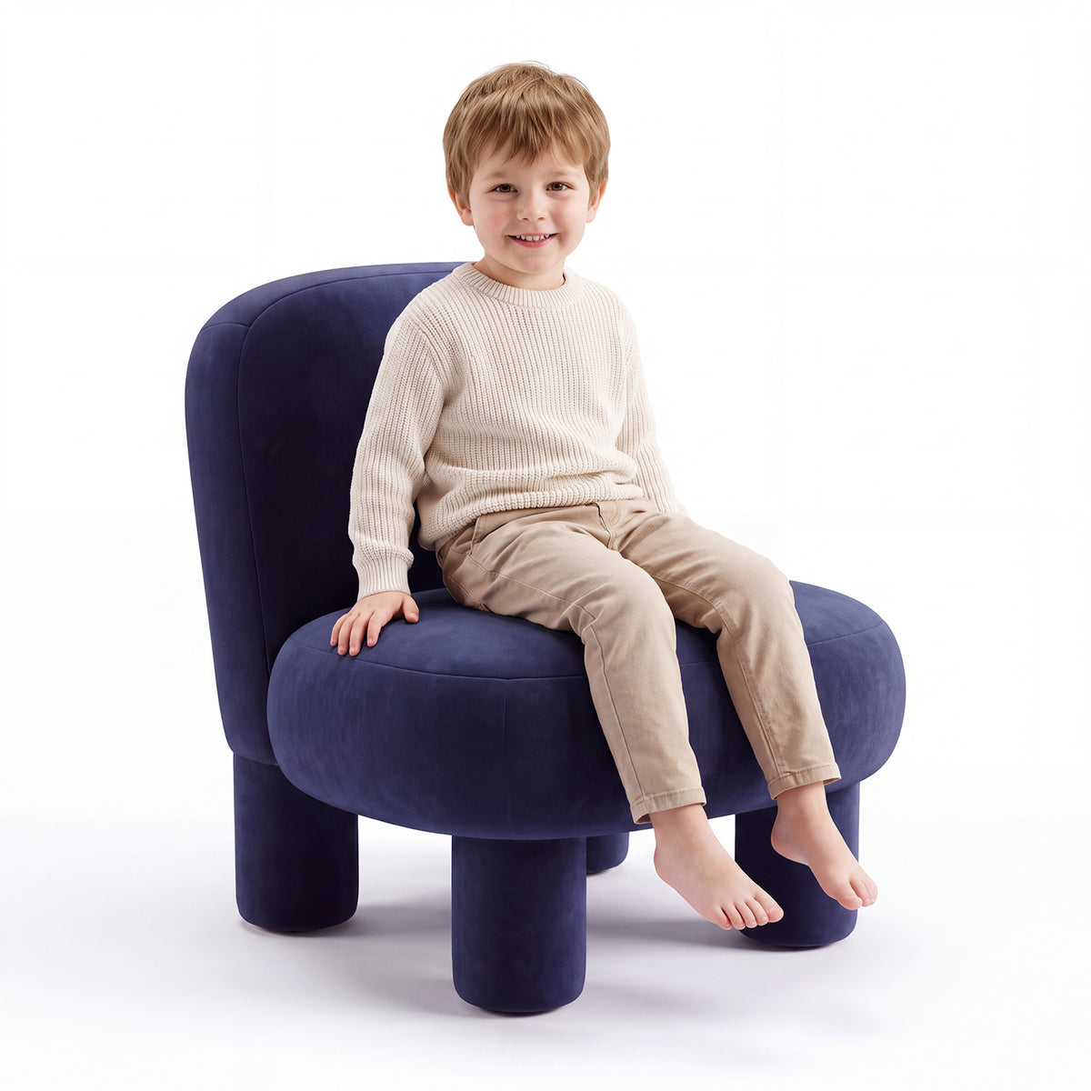 Arlo Kids Armchair from Honest Littles in navy blue upholstery with rounded backrest and cylindrical legs